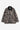 Manteau Lander Carhartt WIP en toile robuste, motif camouflage branches et feuilles, col velours côtelé noir, poches.