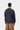 Sweat 1989 Winners Bleu Marine Foncé Carhartt WIP, vu de dos sur un mannequin avec un pantalon marron.