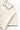 Service Works Blanket Stitch Knit in cream, featuring navy blanket stitching on the collar, button placket, cuffs, and hem.