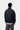 Carhartt WIP Bolon Jacket Dark Navy, vue arrière. Veste homme bleu marine foncé avec col montant, poignets et ourlet côtelés.