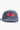 Service Works Carp Patch Cap: Blue hat with a red embroidered carp-shaped patch featuring 'service works' text.