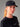 Femme portant une Casquette Active BOLMEN AYAQ noire avec logo blanc et un t-shirt noir, gros plan.