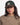 Jeune femme portant la Casquette Six Panel Stanton OLOW verte avec visière en velours côtelé marron et un pull tricoté.