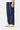 Service Works Classic Chef Pants in navy blue, featuring a drawstring waist and side pockets, worn with off-white sneakers.