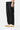 Service Works Classic Chef Pants in black, styled with off-white sneakers, showing a relaxed fit and drawstring waist.