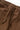 Detail of brown Service Works Classic Chef Pants, showing the elastic waistband and adjustable drawstring.