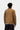 Dos d'une personne portant la veste Carhartt WIP Detroit Jacket Hamilton Brown avec col en velours côtelé marron sur fond blanc.