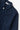 Service Works Easy Chef Shirt, navy blue. Close-up of collar, white button closure, and chest pockets.