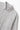 Close-up of the light grey Service Works Easy Chef Shirt, highlighting its collar, white button, pocket, and brand label.