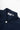 Close-up of the Service Works Easy Chef Shirt in navy blue, showing the collar, white button, and brand label.