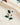 Embroidery Flowers Portuguese Flannel: broderie délicate de fleurs blanches et baies sur tissu crème. Idéal pour un style raffiné.