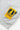 Close-up of a grey Service Works Gardener Vest fabric, featuring a yellow and black 'Daily Specials Service Works' tag.
