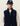 Homme portant un Gilet Teddy Les Deux bleu marine avec un patch, un pull beige et une casquette LD.