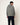 Homme portant un hoodie Homecore Terry gris-vert texturé avec cordon à embouts rouges et un pantalon bleu foncé.