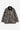 Manteau Lander Carhartt WIP en toile robuste, motif camouflage branches et feuilles, col velours côtelé noir, poches.