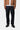 Pantalon Newel Carhartt WIP bleu One Wash porté avec veste marron et chaussures noires.
