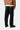 Homme portant un pantalon Carhartt WIP Newel bleu One Wash, dos visible, avec le logo sur la poche arrière.