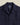 Gros plan sur la chemise Palm Portuguese Flannel bleu marine, motif texturé feuille de palmier discret et col à revers.