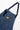 Service Works Pinstripe Denim Apron, blue with white pinstripes, orange brand label, and pocket detail.