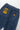 Service Works Pinstripe Denim Chef Pants, back view with hang tag, elastic waist, and pockets