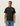 T-shirt Rural Les Deux vert foncé avec logo blanc sur la poitrine, porté par un homme.