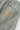 Close-up of Service Works Seersucker Chef Shorts in light green, showing the textured fabric and back pocket with brand label.