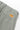 Service Works Seersucker Part Timer Pants, close-up of light green seersucker fabric and orange brand label on the back.