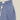 Shorts Portuguese Flannel bleu à motif carreaux abstraits blancs, ceinture élastique et cordon de serrage blanc.