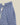 Shorts Portuguese Flannel bleu à motif carreaux abstraits blancs, ceinture élastique et cordon de serrage blanc.