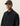 Homme portant une Surchemise Ripstop noire Les Deux avec des poches et une casquette en velours côtelé kaki.