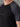 T-shirt 100% Mérinos BIAFO AYAQ noir et gris avec manches raglan courtes porté par un homme.