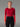 T-Shirt 100% Mérinos MEFONNA AYAQ rouge pour femme, manches longues, porté avec legging noir.
