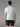 Vue de dos d'un homme portant le T-shirt Technique MOLVENO AYAQ bleu clair et un short de sport noir. Textile technique respirant.