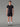 Homme portant un T-shirt Trail/Running Stamina MOLVENO AYAQ noir et un short noir pour la course, sur fond gris.