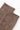 Close-up of the mottled brown and white ribbed knit fabric texture of The Gardener's Sock by Service Works.
