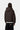 Veste à capuche Ebbert Tabac Carhartt WIP portée de dos avec un pantalon en velours côtelé noir.