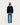 Homme portant la Veste Majic Bio Dark Navy de HOMECORE avec un jean bleu et des chaussures noires.