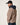 Veste r&eacute;versible laine Swit Salt HOMECORE Henna Brown port&eacute;e par un homme avec une casquette, vue de dos.