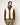 Veste sans manches Troy HOMECORE en sherpa crème avec liseré marron portée par un homme avec un pull marron